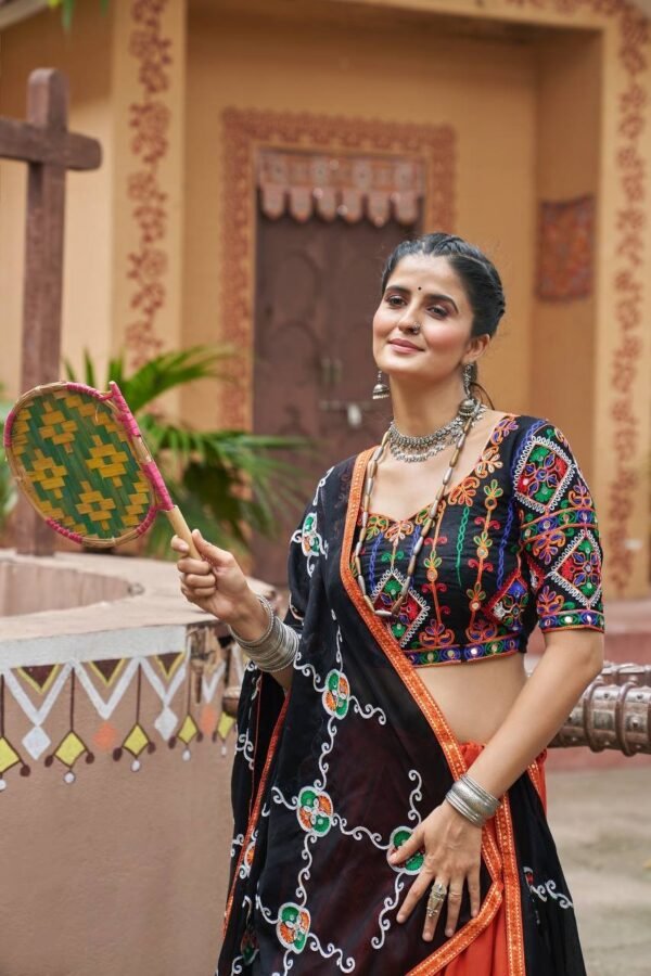 Chaniya-Choli-16-1.jpg Radiant Orange Embroidered Mirror Work Chaniya Choli for Navratri | Shop Now - Image 2