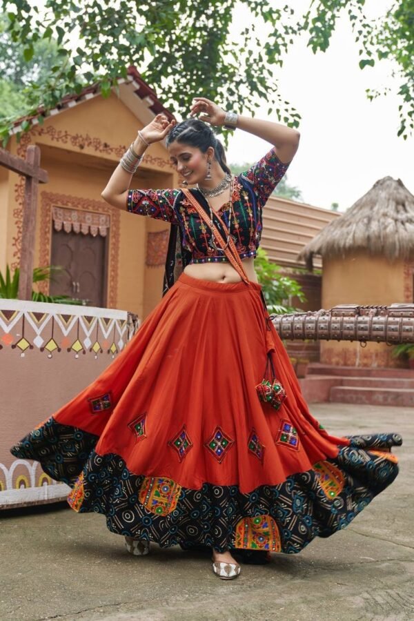 Chaniya-Choli-17-1-1.jpg Radiant Orange Embroidered Mirror Work Chaniya Choli for Navratri | Shop Now - Image 4