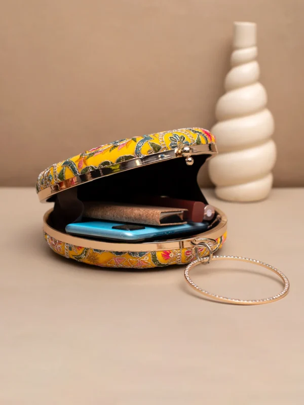 women designer clutches30 Designer Round Ethnic Clutch